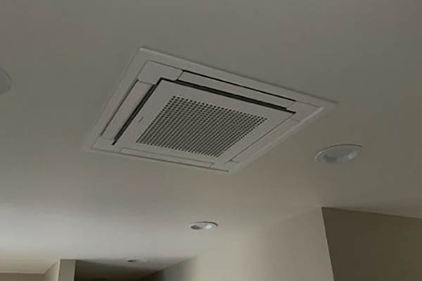 Ceiling Cassette Heat Pump Unit Ceiling-mounted cassette heat pump indoor unit installed by Dave’s Heating.